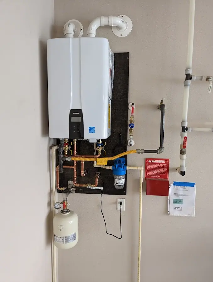 Professional plumber installing copper piping in a West Amwell home